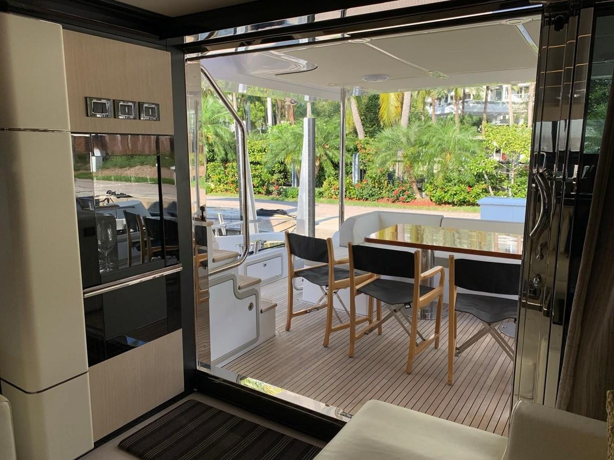a room with a table and chairs aboard AMALFI Yacht for Sale