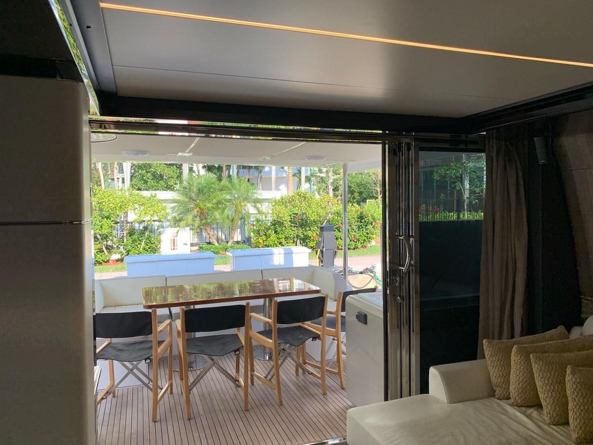 a room with a table and chairs aboard AMALFI Yacht for Sale