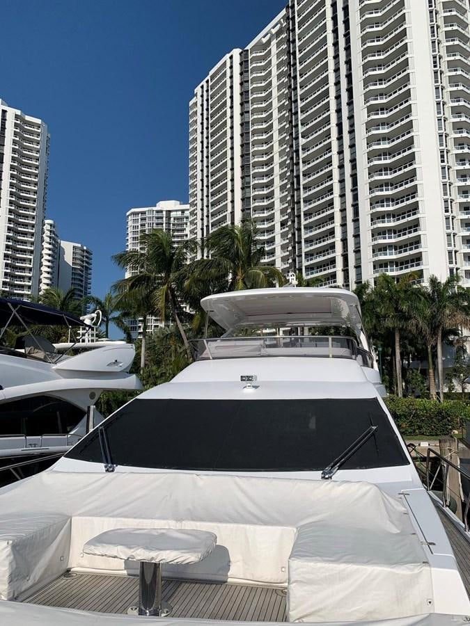 a white yacht in a city aboard AMALFI Yacht for Sale