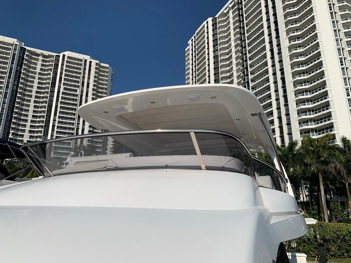 a white car in a city aboard AMALFI Yacht for Sale