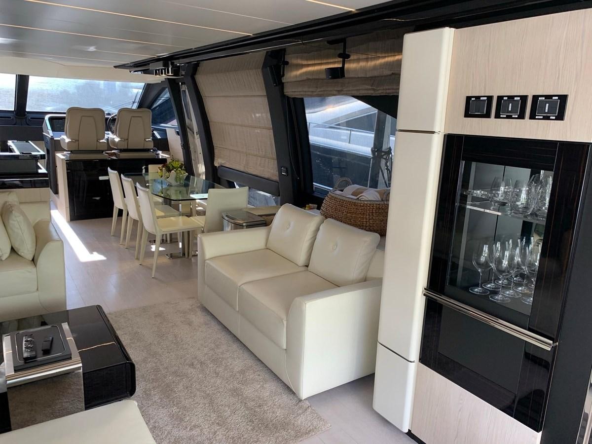 a living room with a couch and a table aboard AMALFI Yacht for Sale
