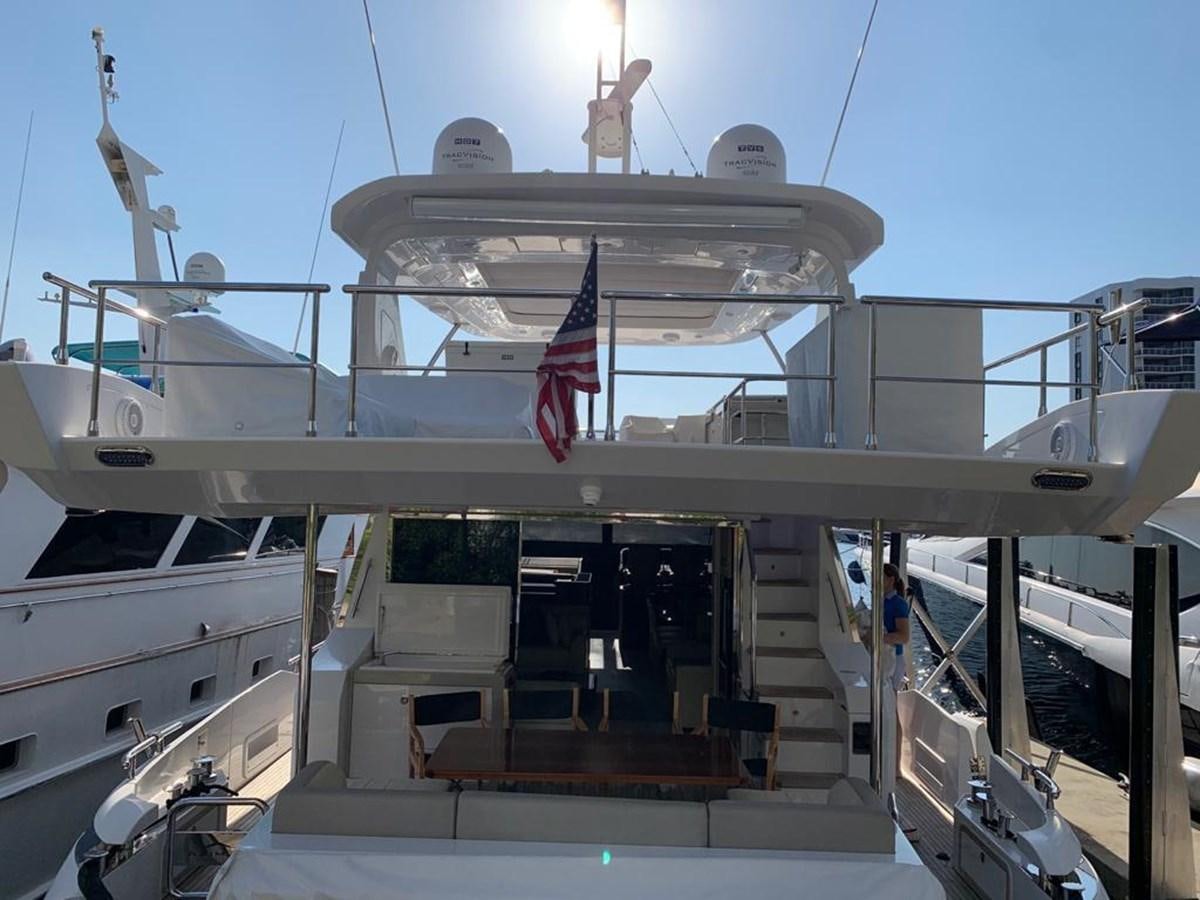 a large white boat with flags on it aboard AMALFI Yacht for Sale