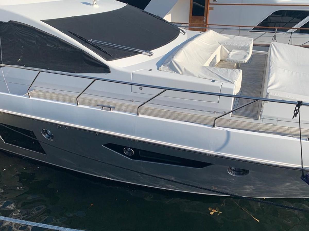 a white yacht on a dock aboard AMALFI Yacht for Sale