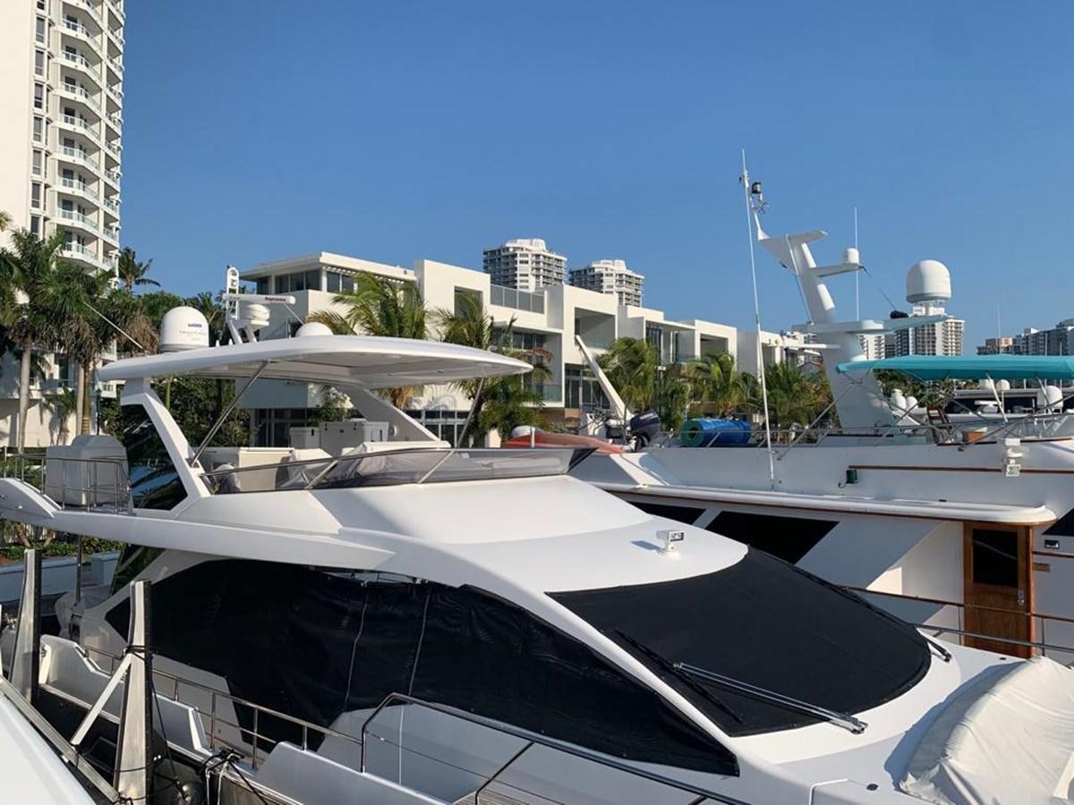 a white boat in a harbor aboard AMALFI Yacht for Sale