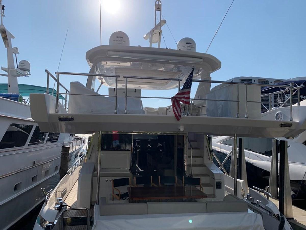 a large ship with a flag on the deck aboard AMALFI Yacht for Sale
