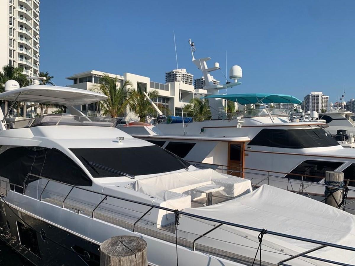 a few yachts in a harbor aboard AMALFI Yacht for Sale