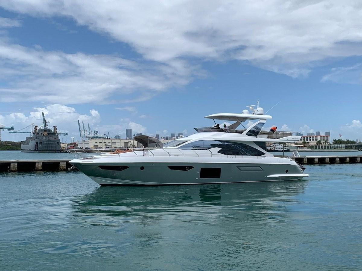 a white yacht in a harbor aboard AMALFI Yacht for Sale