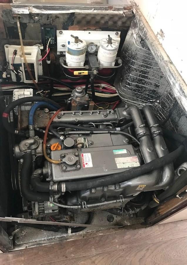a car engine with a red handle aboard RUGOSA Yacht for Sale