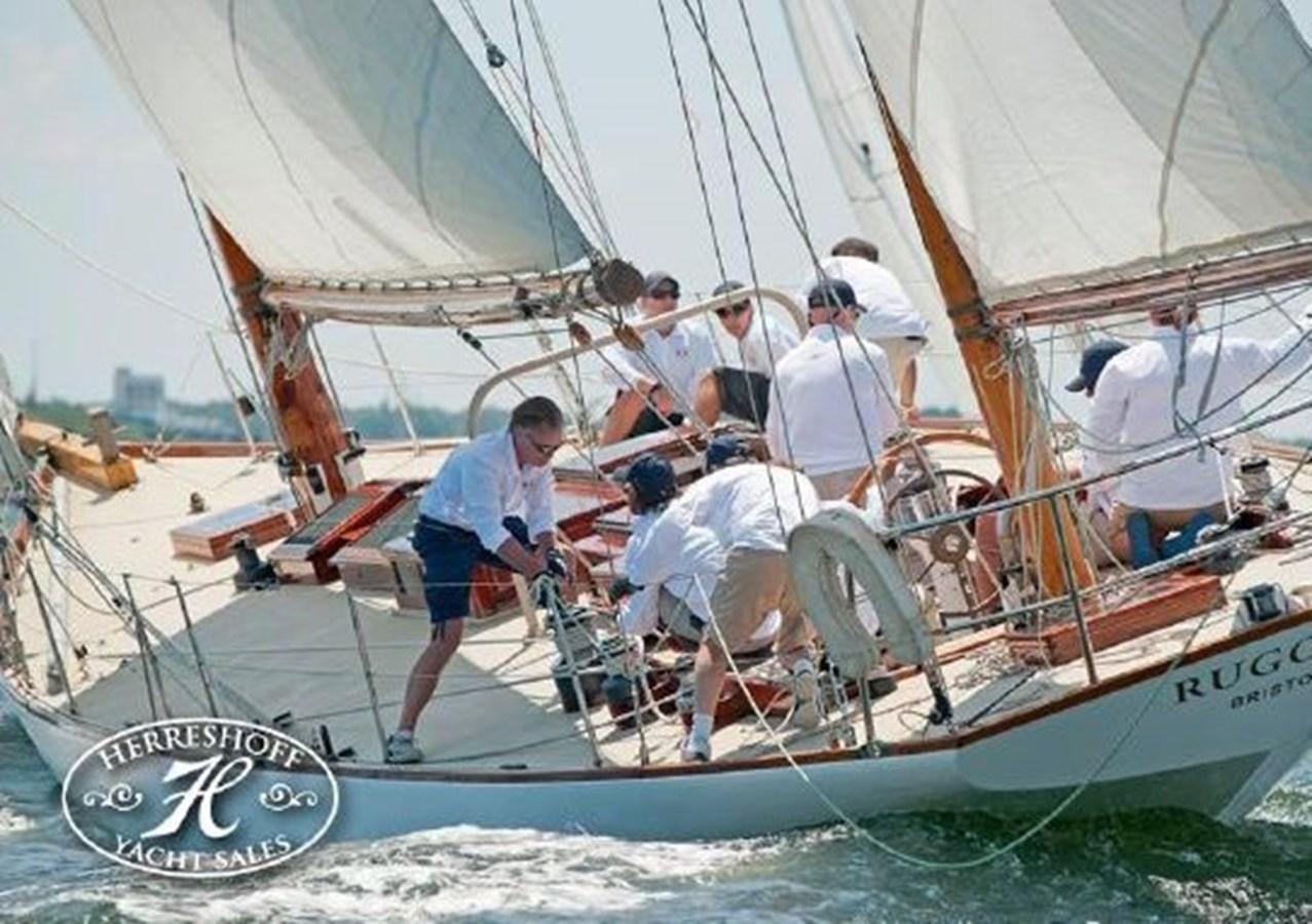 a group of men on a sailboat aboard RUGOSA Yacht for Sale