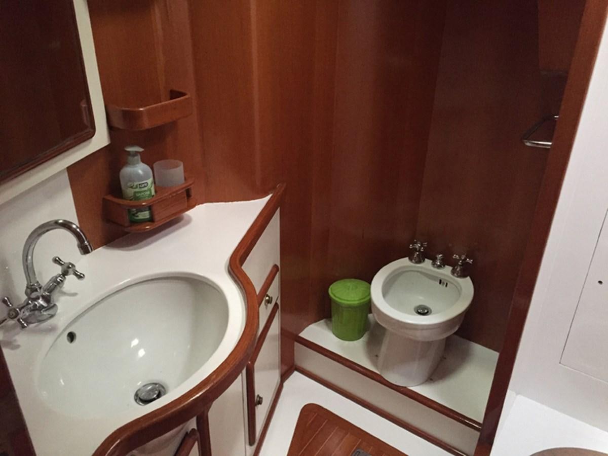 a bathroom with a toilet and sink aboard MORGANA Yacht for Sale