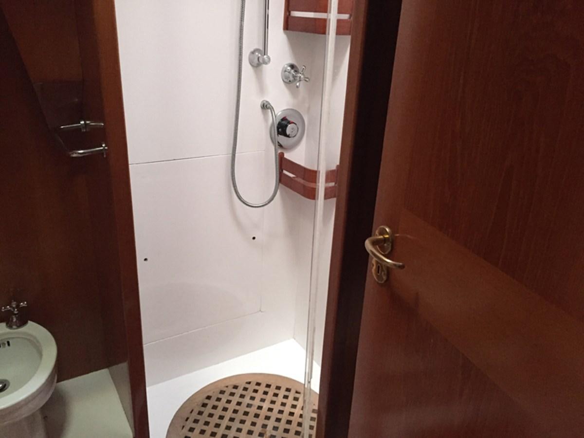 a bathroom with a red door aboard MORGANA Yacht for Sale