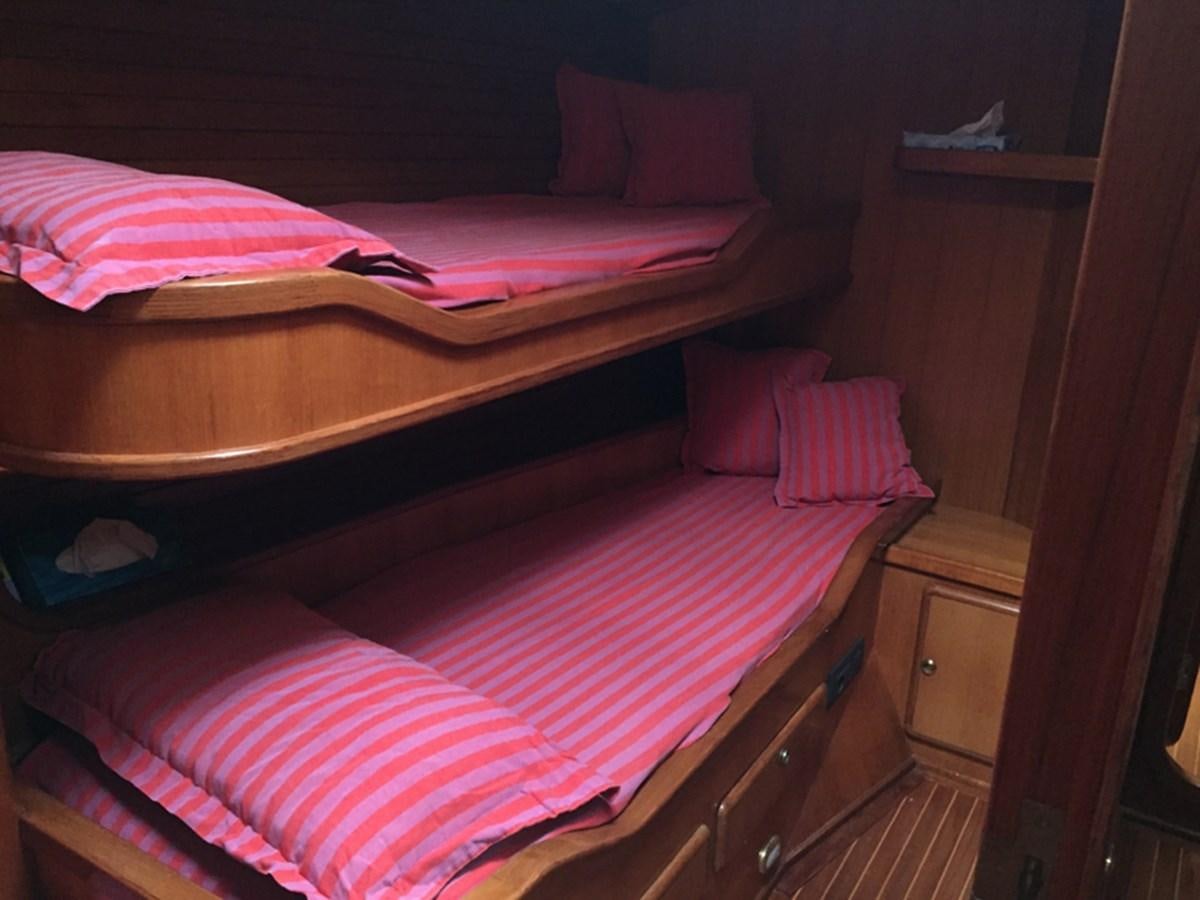 a bed with pink pillows aboard MORGANA Yacht for Sale