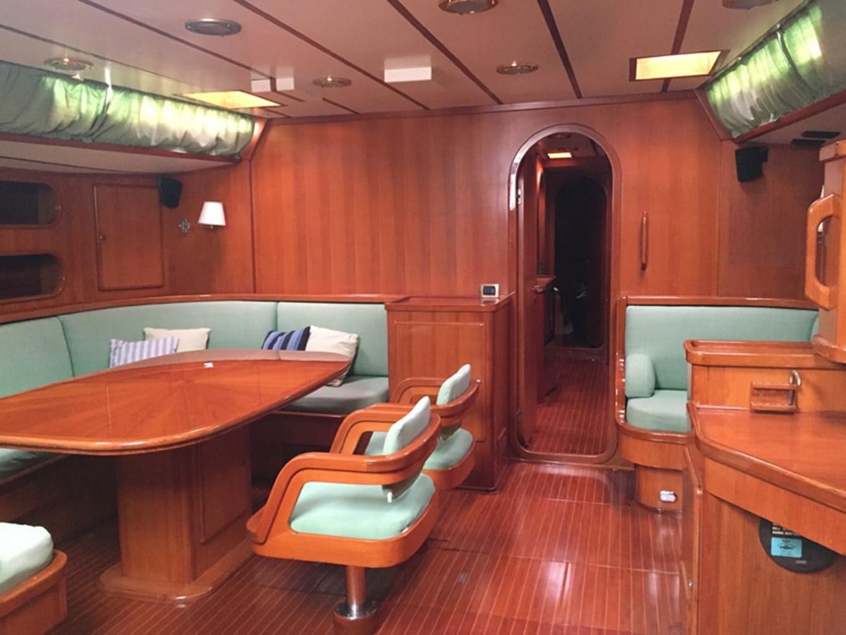 a room with a table and chairs aboard MORGANA Yacht for Sale