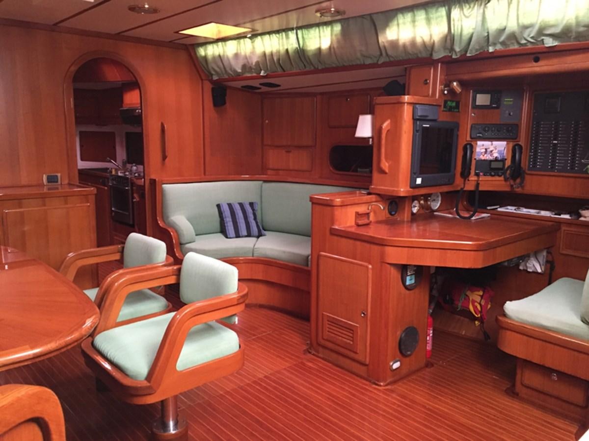 a room with a couch and a television aboard MORGANA Yacht for Sale