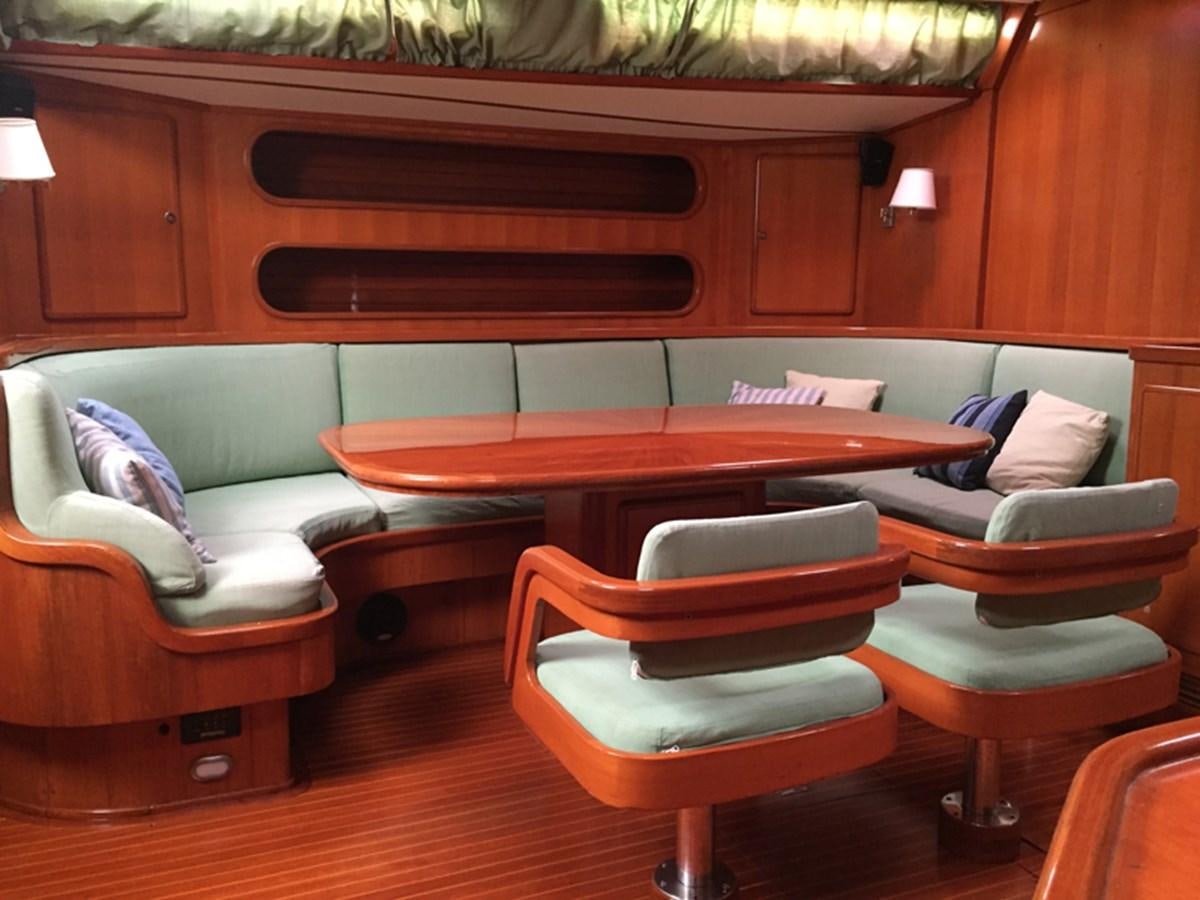a room with a table and chairs aboard MORGANA Yacht for Sale