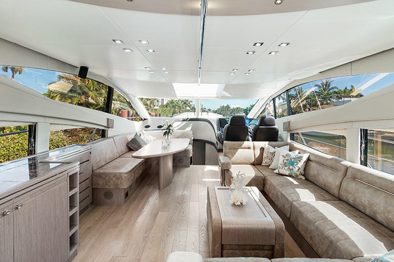 a living room with a couch and a table aboard LONG WAY ROUND Yacht for Sale
