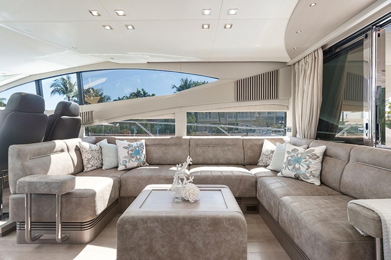 a living room with a couch and a table aboard LONG WAY ROUND Yacht for Sale