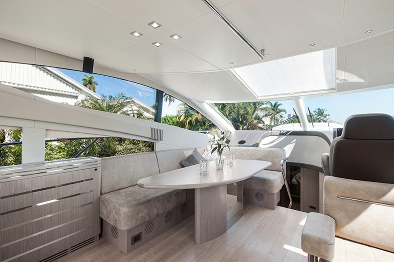 a room with a table and chairs aboard LONG WAY ROUND Yacht for Sale