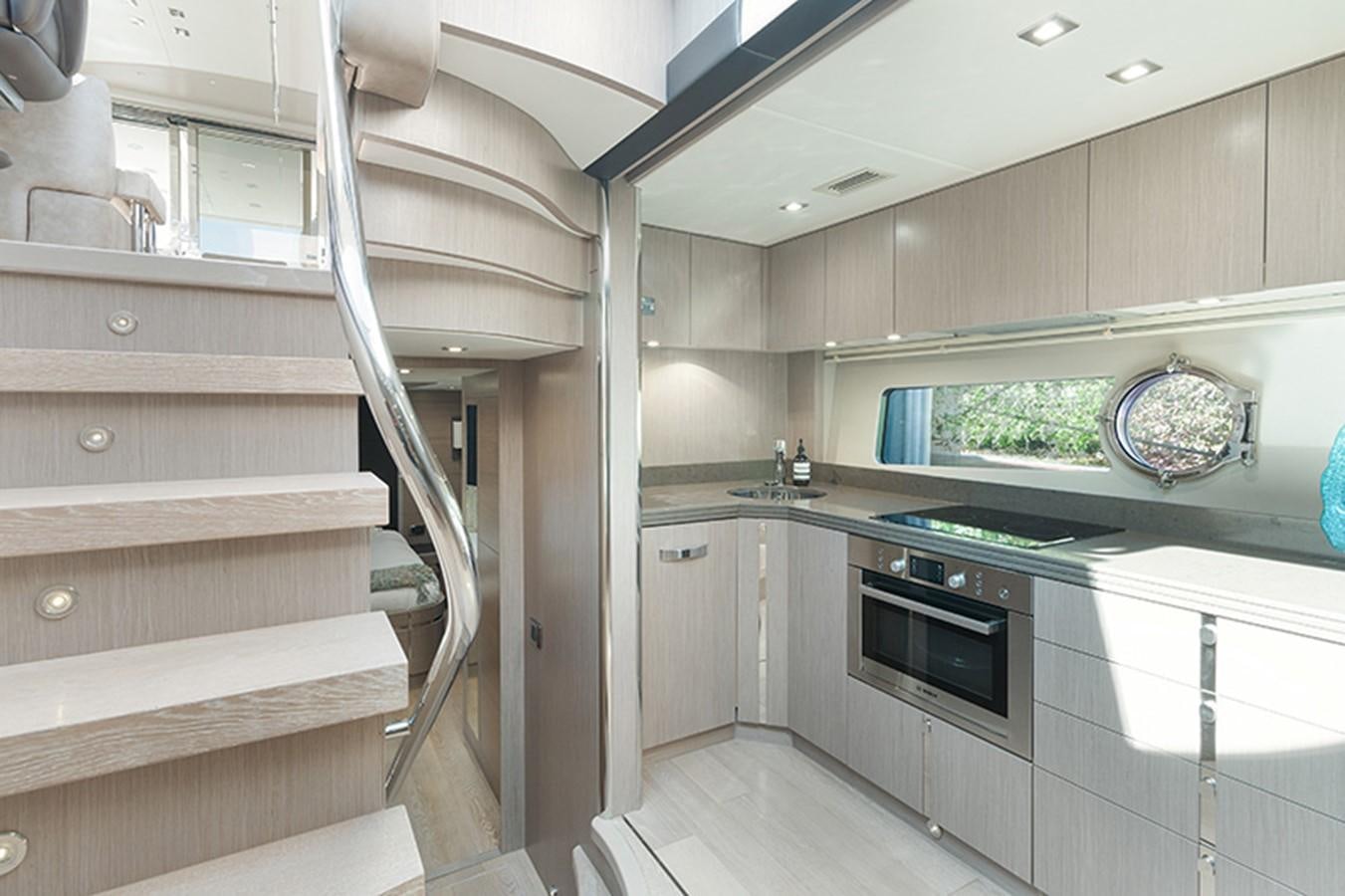 a kitchen with a staircase aboard LONG WAY ROUND Yacht for Sale