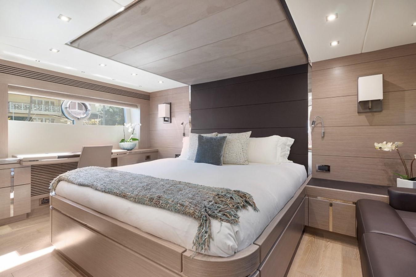 a large bed in a room aboard LONG WAY ROUND Yacht for Sale
