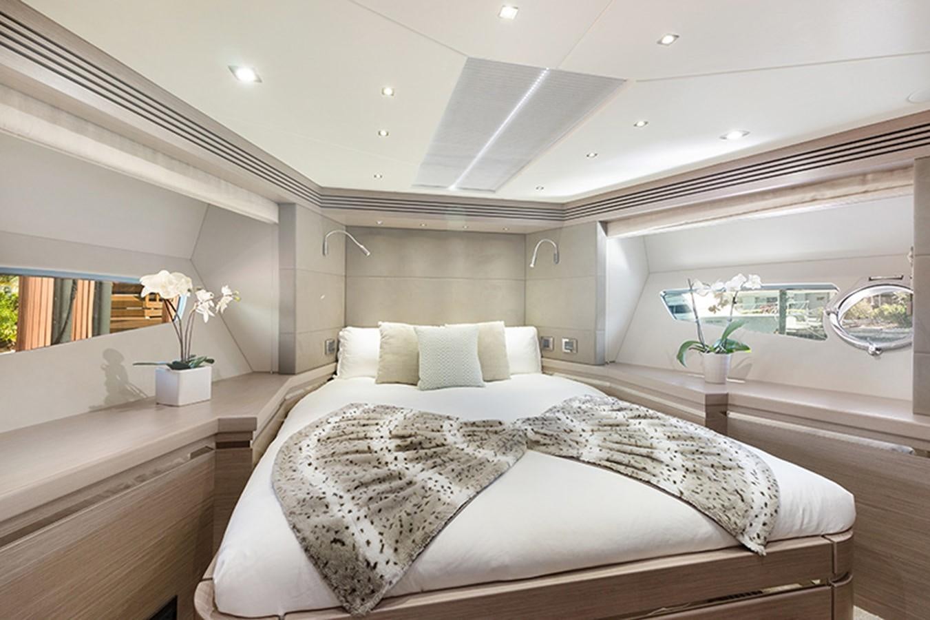 a large bed in a room aboard LONG WAY ROUND Yacht for Sale