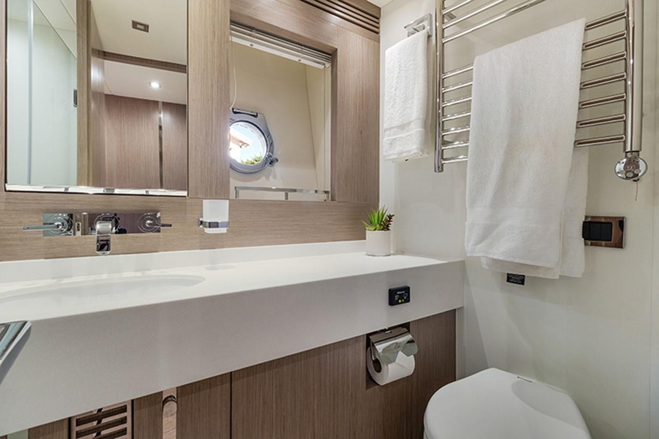 a bathroom with a sink and toilet aboard LONG WAY ROUND Yacht for Sale