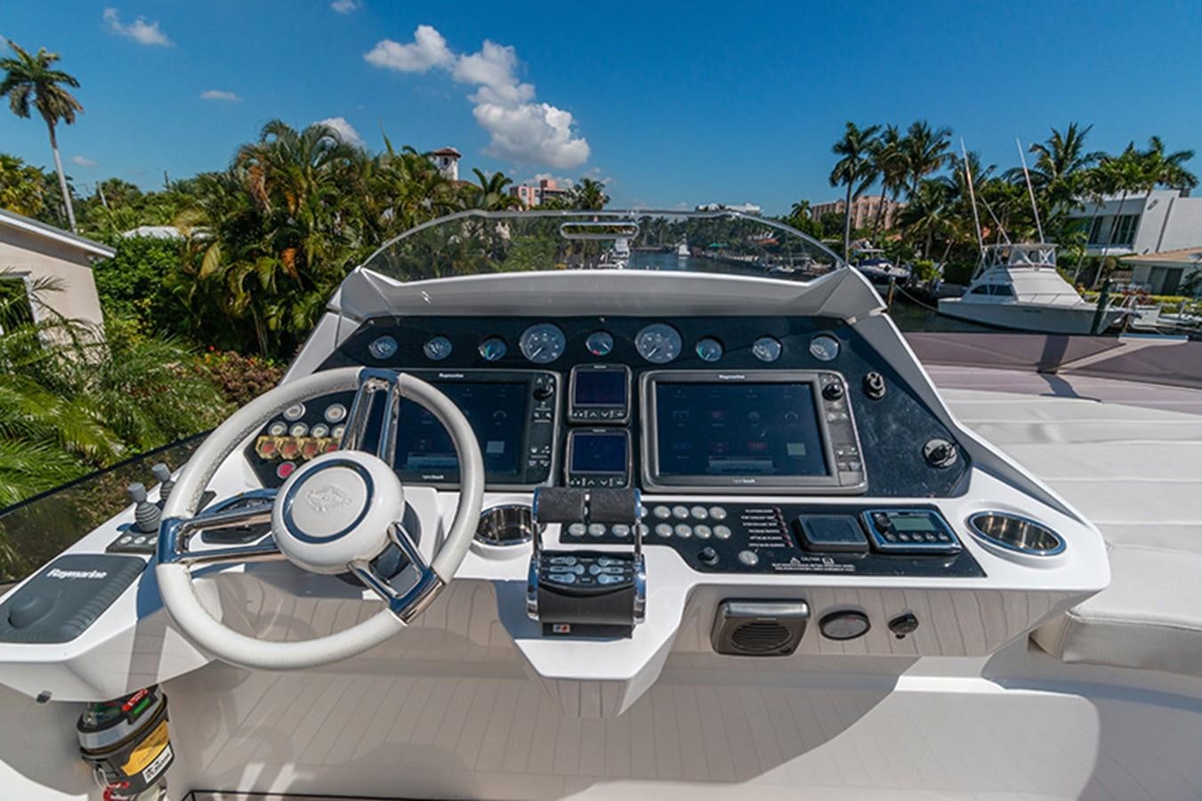 a car with a steering wheel aboard LONG WAY ROUND Yacht for Sale