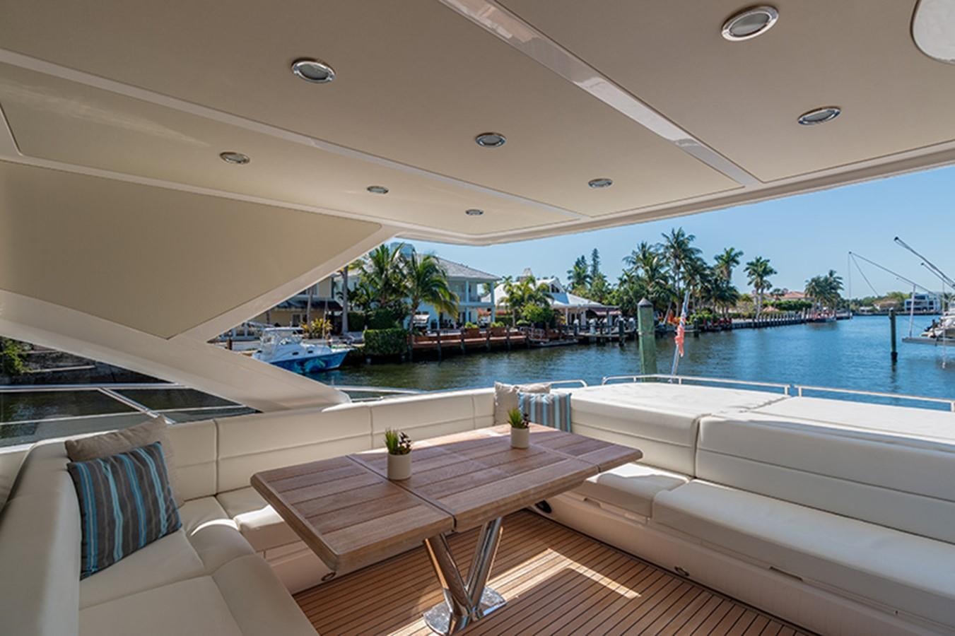 a pool with a table and chairs aboard LONG WAY ROUND Yacht for Sale