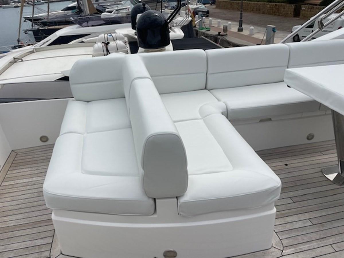 a white boat with a white cover aboard LONG WAY ROUND Yacht for Sale