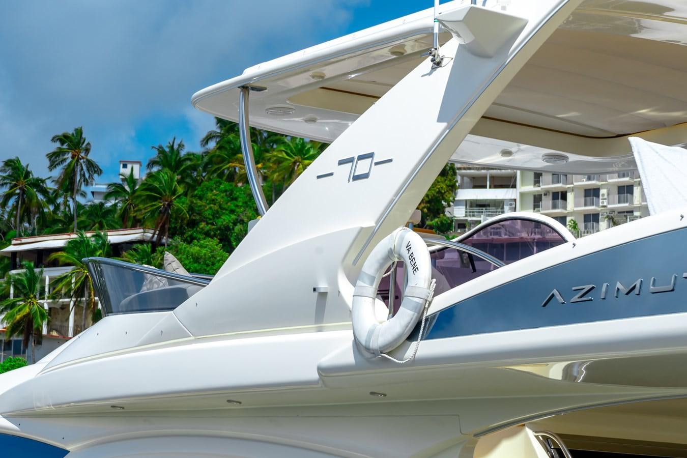 a plane parked in front of a building aboard VA BENE 2011 AZIMUT 70 FLY Yacht for Sale