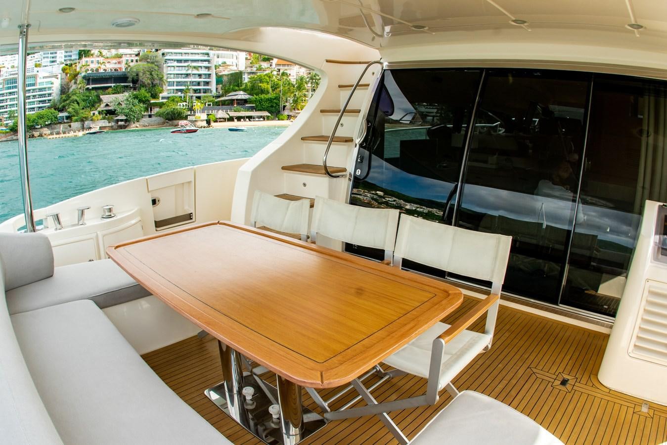 a room with a table and chairs aboard VA BENE 2011 AZIMUT 70 FLY Yacht for Sale