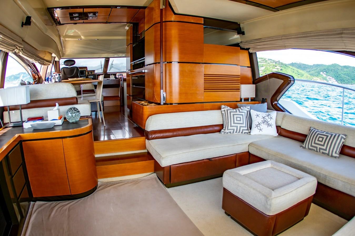 a room with a couch and a table aboard VA BENE 2011 AZIMUT 70 FLY Yacht for Sale