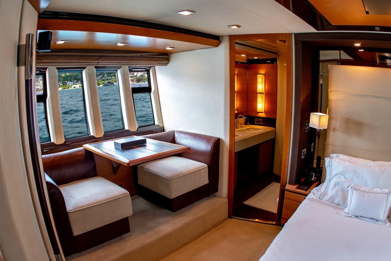a room with a bed and a desk aboard VA BENE 2011 AZIMUT 70 FLY Yacht for Sale