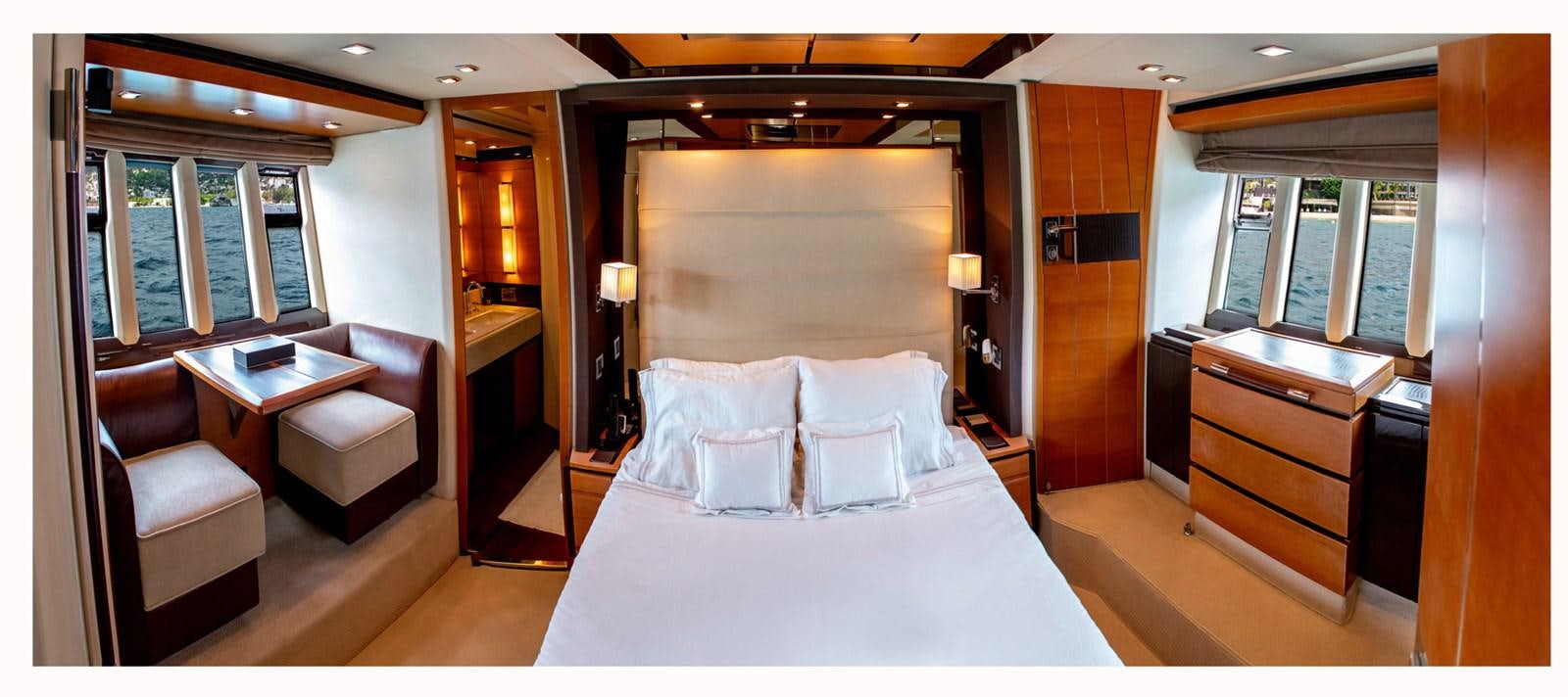 a room with a bed and a desk aboard VA BENE 2011 AZIMUT 70 FLY Yacht for Sale