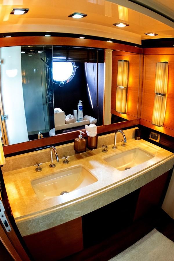 a bathroom with two sinks aboard VA BENE 2011 AZIMUT 70 FLY Yacht for Sale