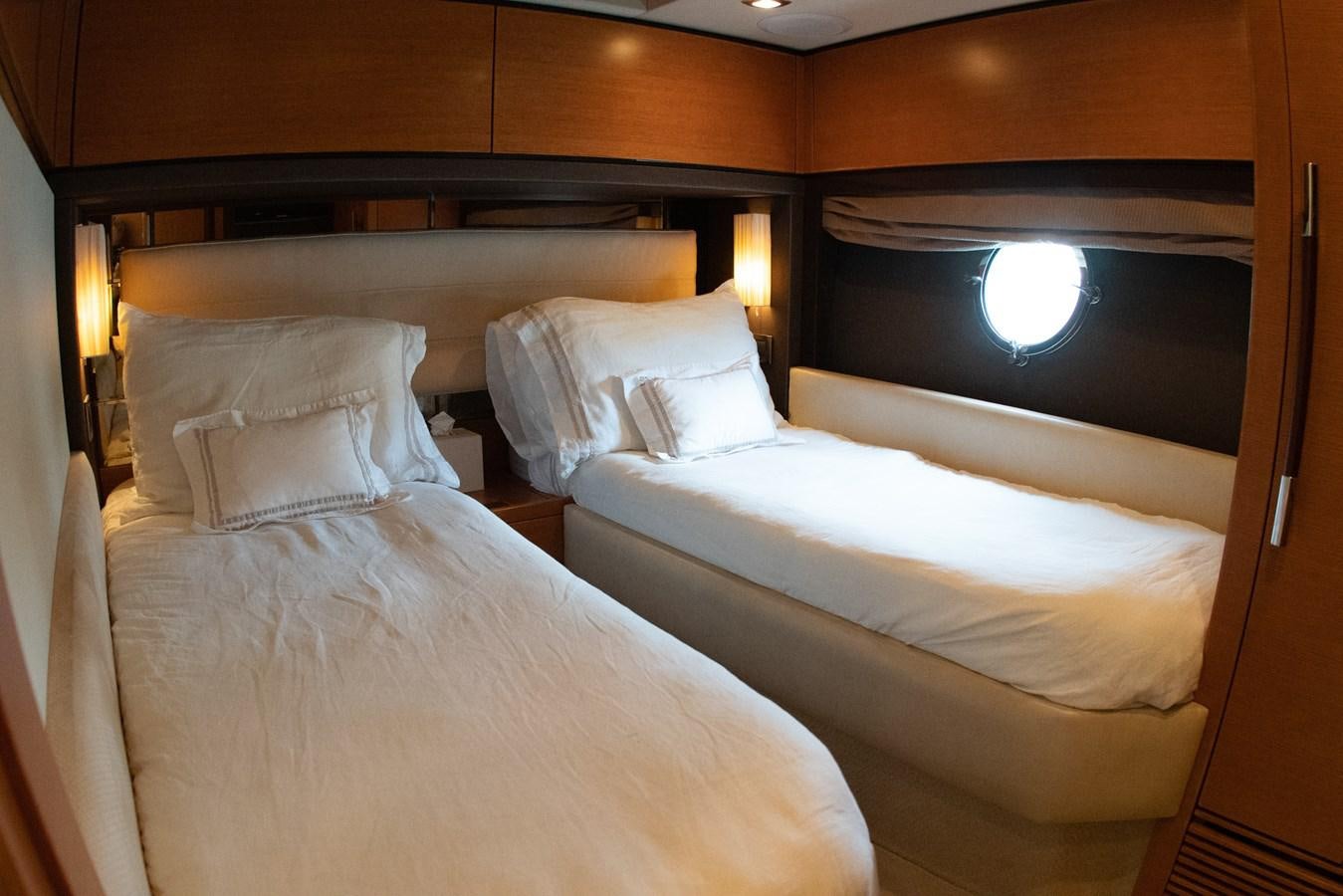a couple of beds in a hotel room aboard VA BENE 2011 AZIMUT 70 FLY Yacht for Sale