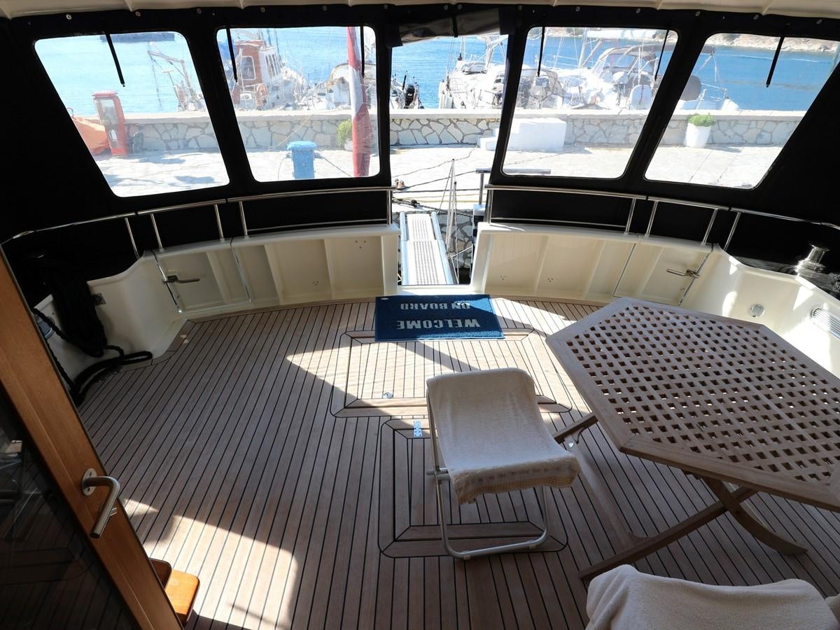 a room with a table and chairs aboard Polar Princess Yacht for Sale