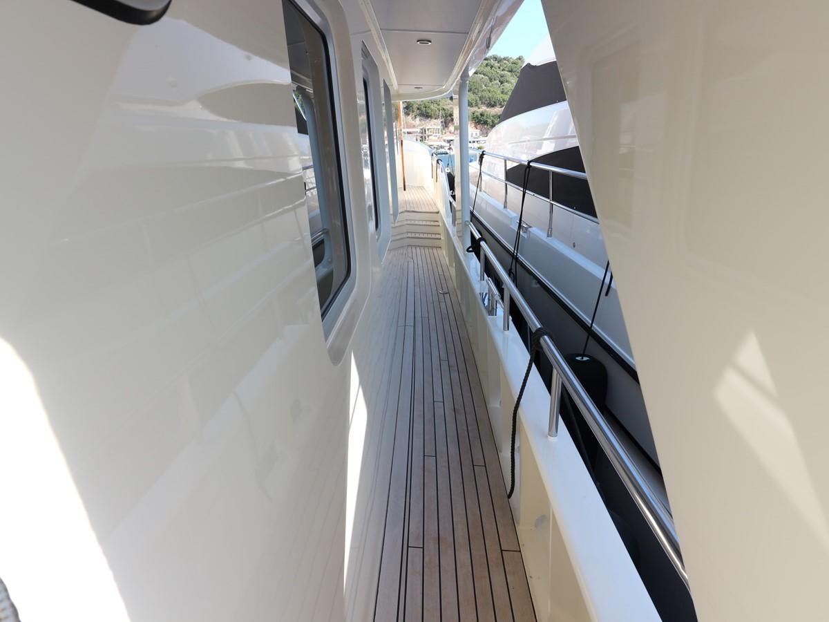 a hallway with white walls aboard Polar Princess Yacht for Sale