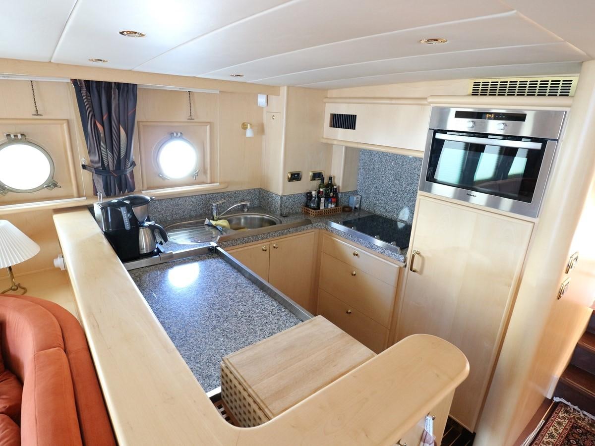 a kitchen with a microwave oven aboard Polar Princess Yacht for Sale