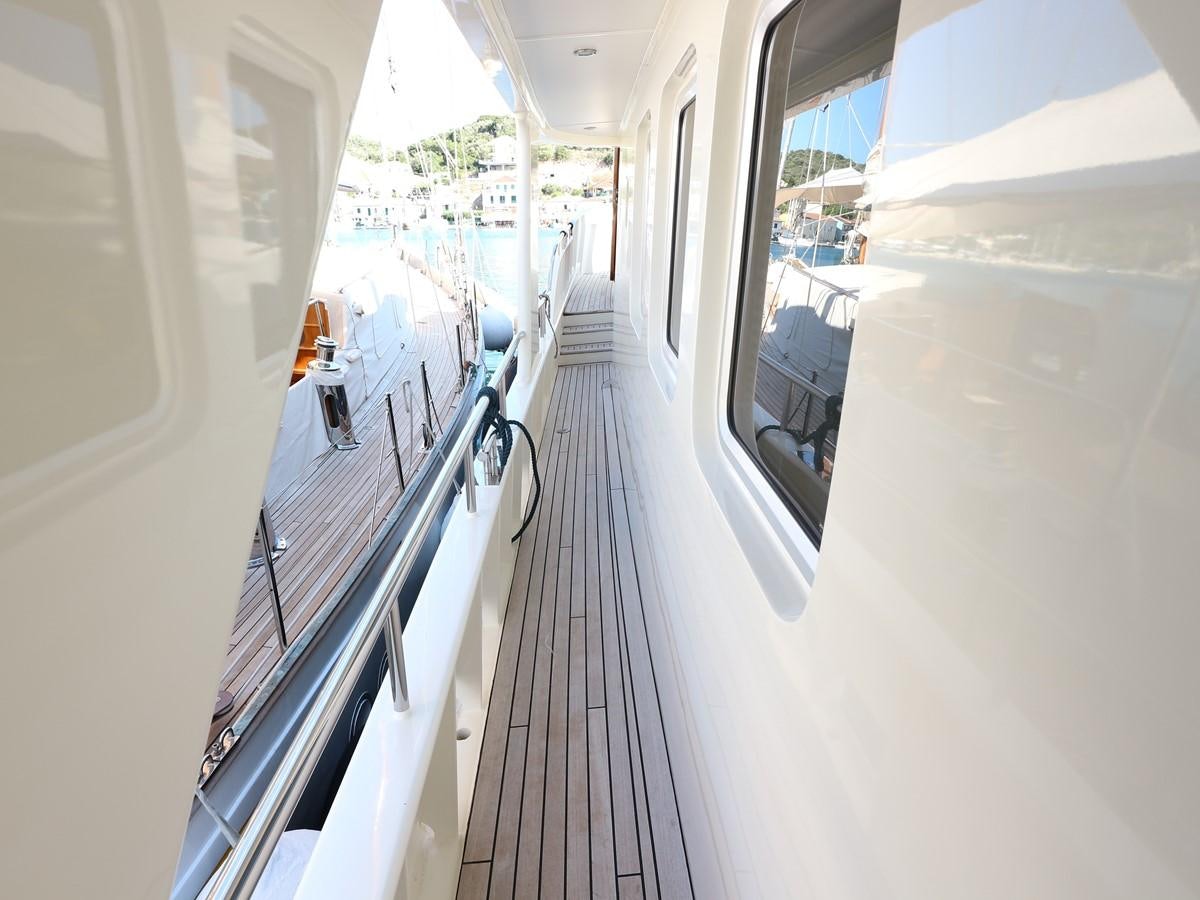 a long hallway with a group of chairs and a table aboard Polar Princess Yacht for Sale