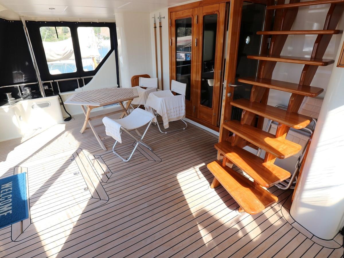 a room with a table chairs and a window aboard Polar Princess Yacht for Sale