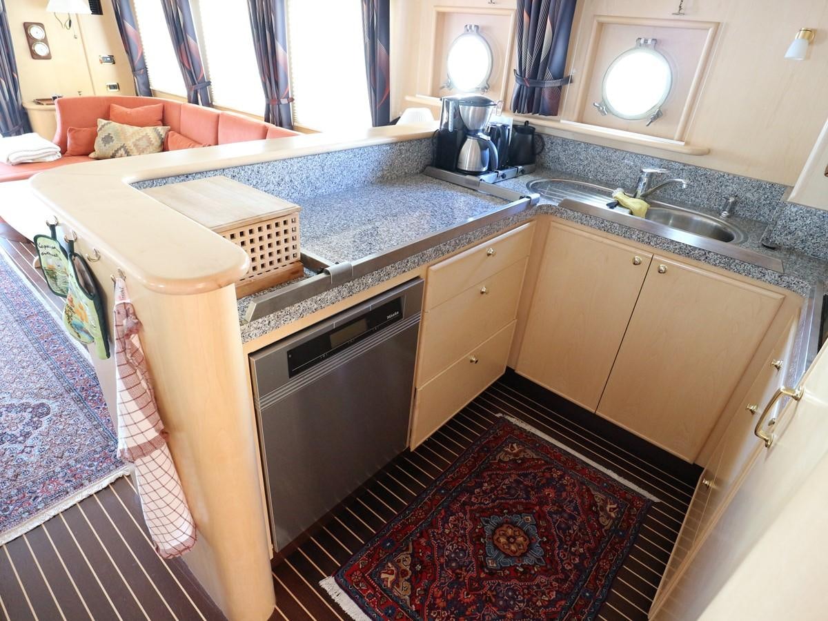 a kitchen with a sink and a rug aboard Polar Princess Yacht for Sale