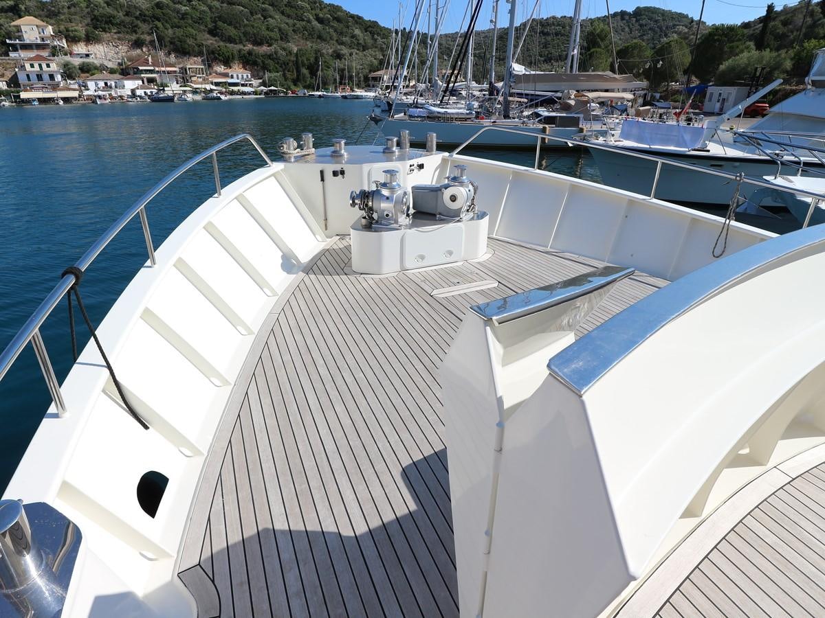 a large white boat with a black stripe on it aboard Polar Princess Yacht for Sale