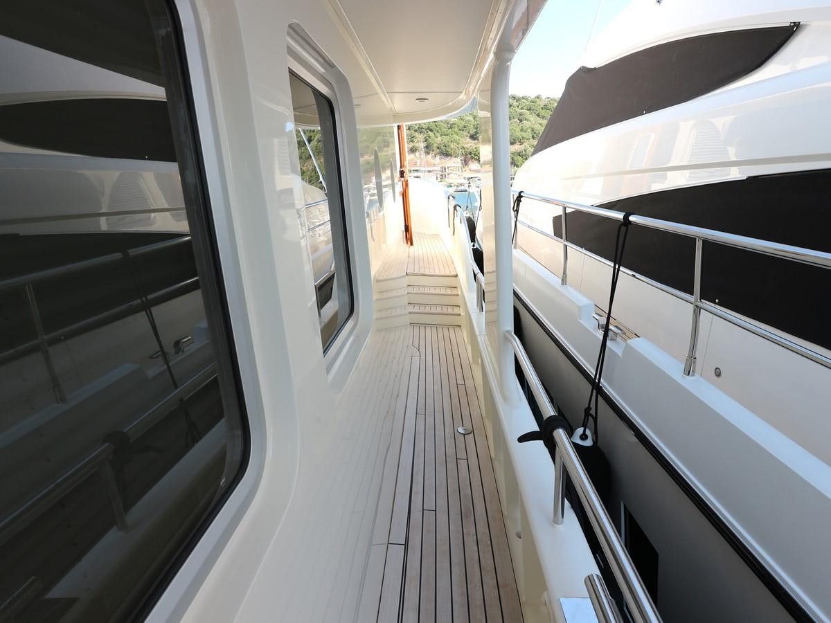 a person sitting on a bench in a train station aboard Polar Princess Yacht for Sale