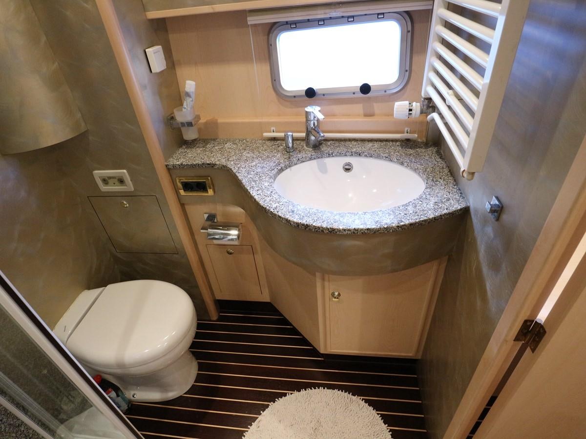 a bathroom with a sink and a toilet aboard Polar Princess Yacht for Sale