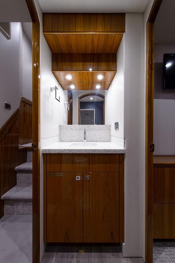 a bathroom with a sink and a mirror aboard NOTORIOUS Yacht for Sale