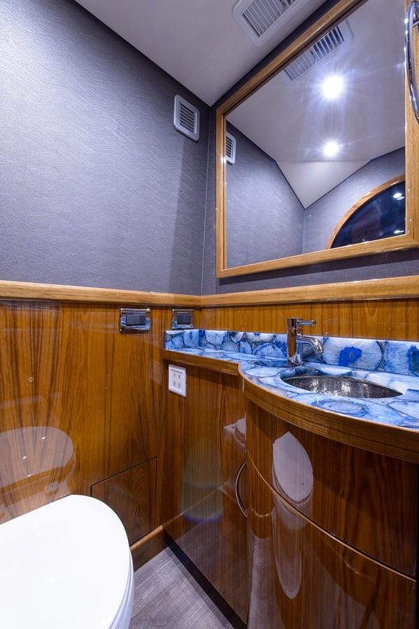 a bathroom with a sink and a mirror aboard NOTORIOUS Yacht for Sale