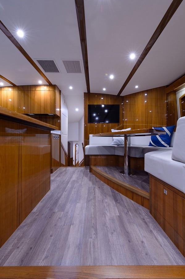 a room with a bed and a table aboard NOTORIOUS Yacht for Sale