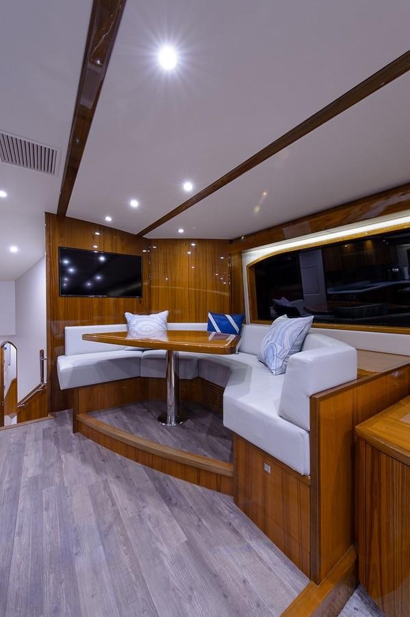 a room with a bed and a television aboard NOTORIOUS Yacht for Sale