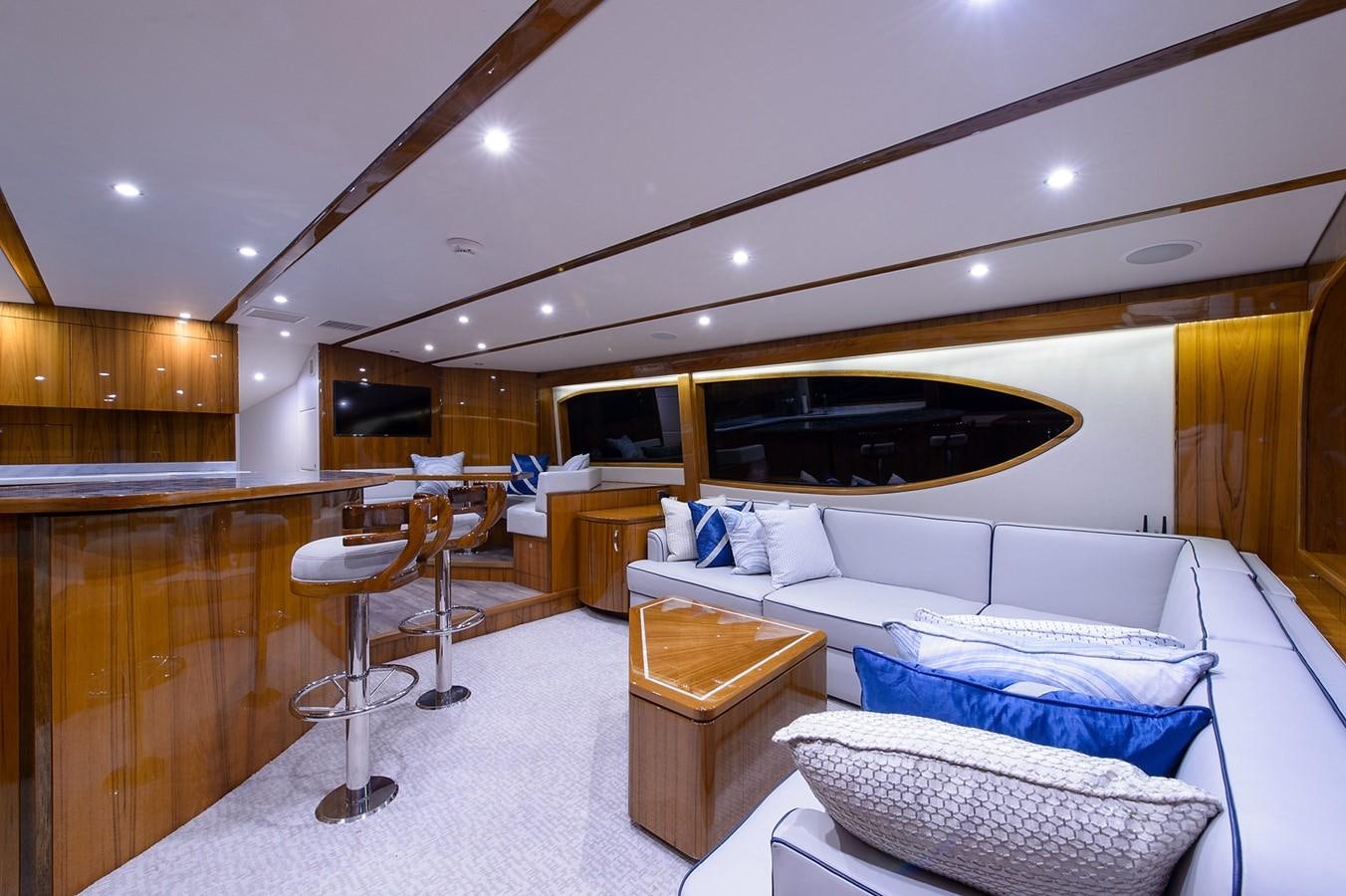 a room with a bed and a desk aboard NOTORIOUS Yacht for Sale